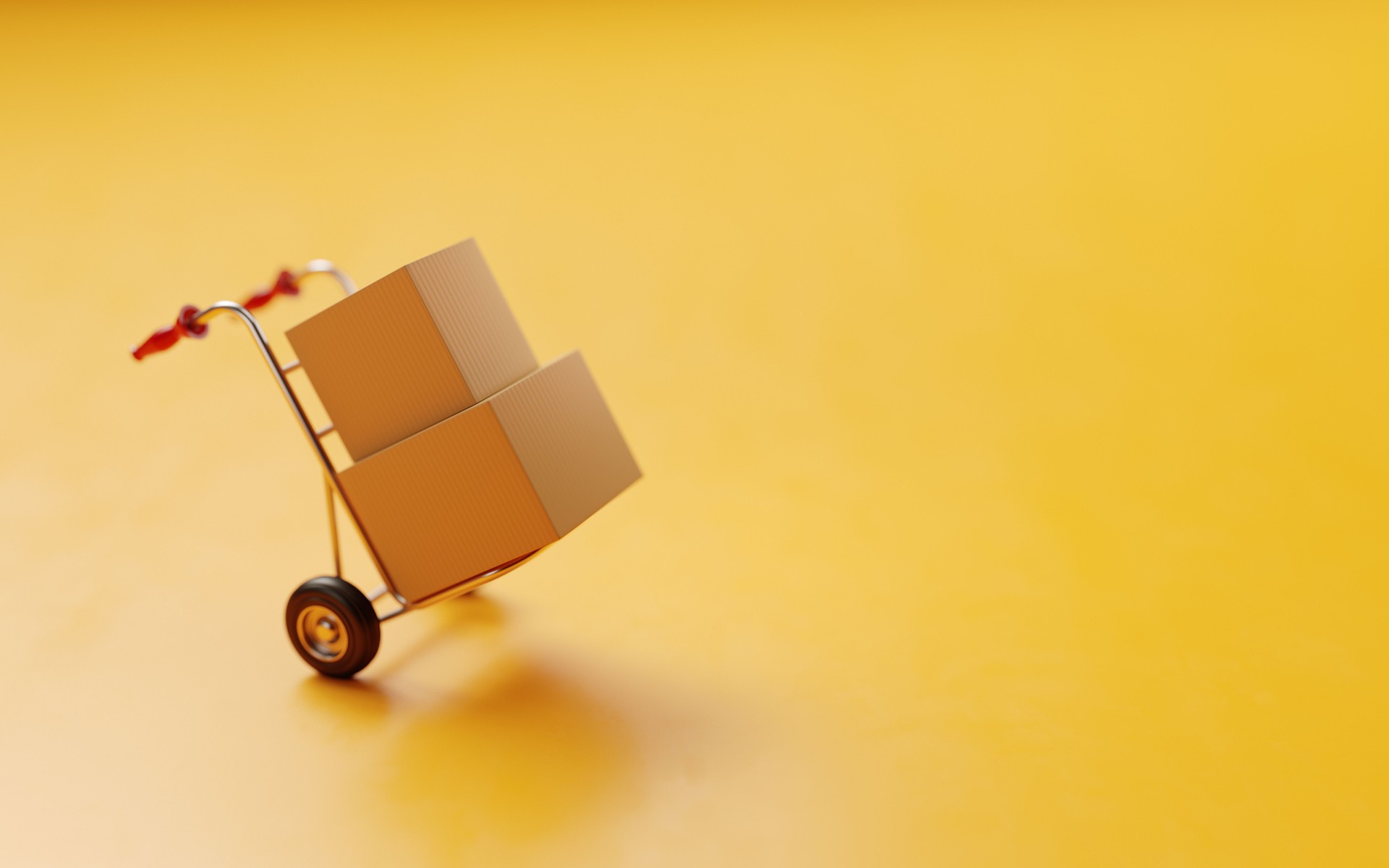 Card boxes On A Hand Truck On Yellow Background